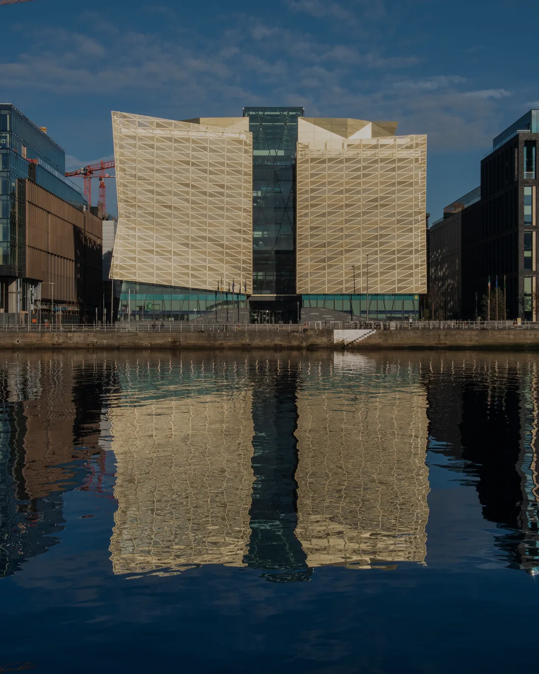 Central Bank of Ireland headquarters on North Wall Quay, Dublin, reflected in the River Liffey